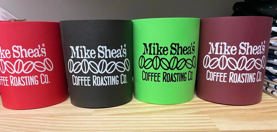 Mike Shea's Coffee Roasting can huggers in assorted colors